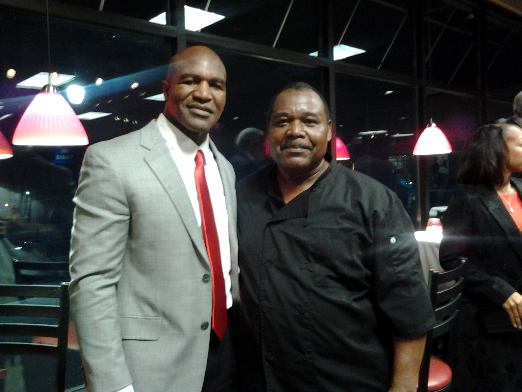 Former Heavyweight Boxing Champion Evander Holyfield with Ms. Piggies' co-founder